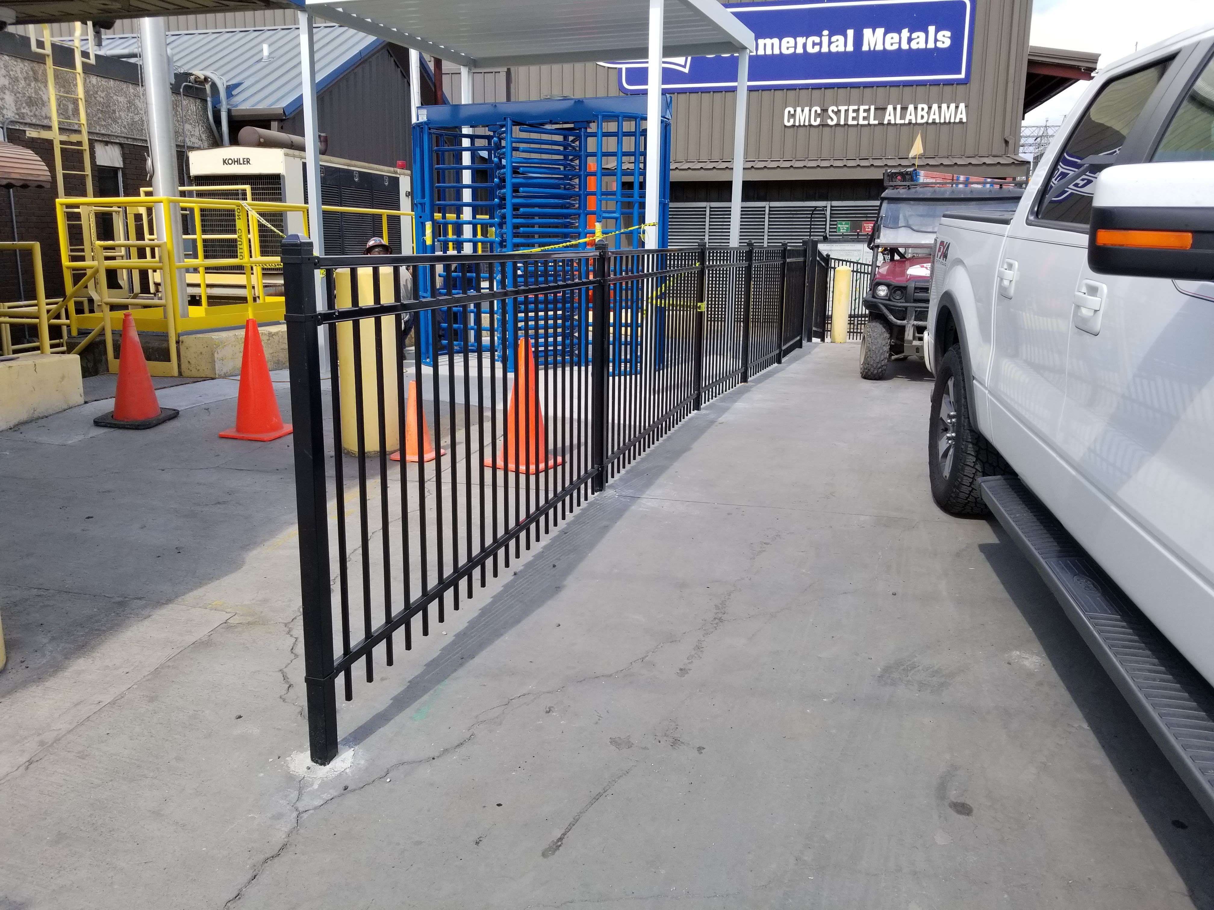 Photo of employee entrance with Alvarado’s full-height tandem turnstile.