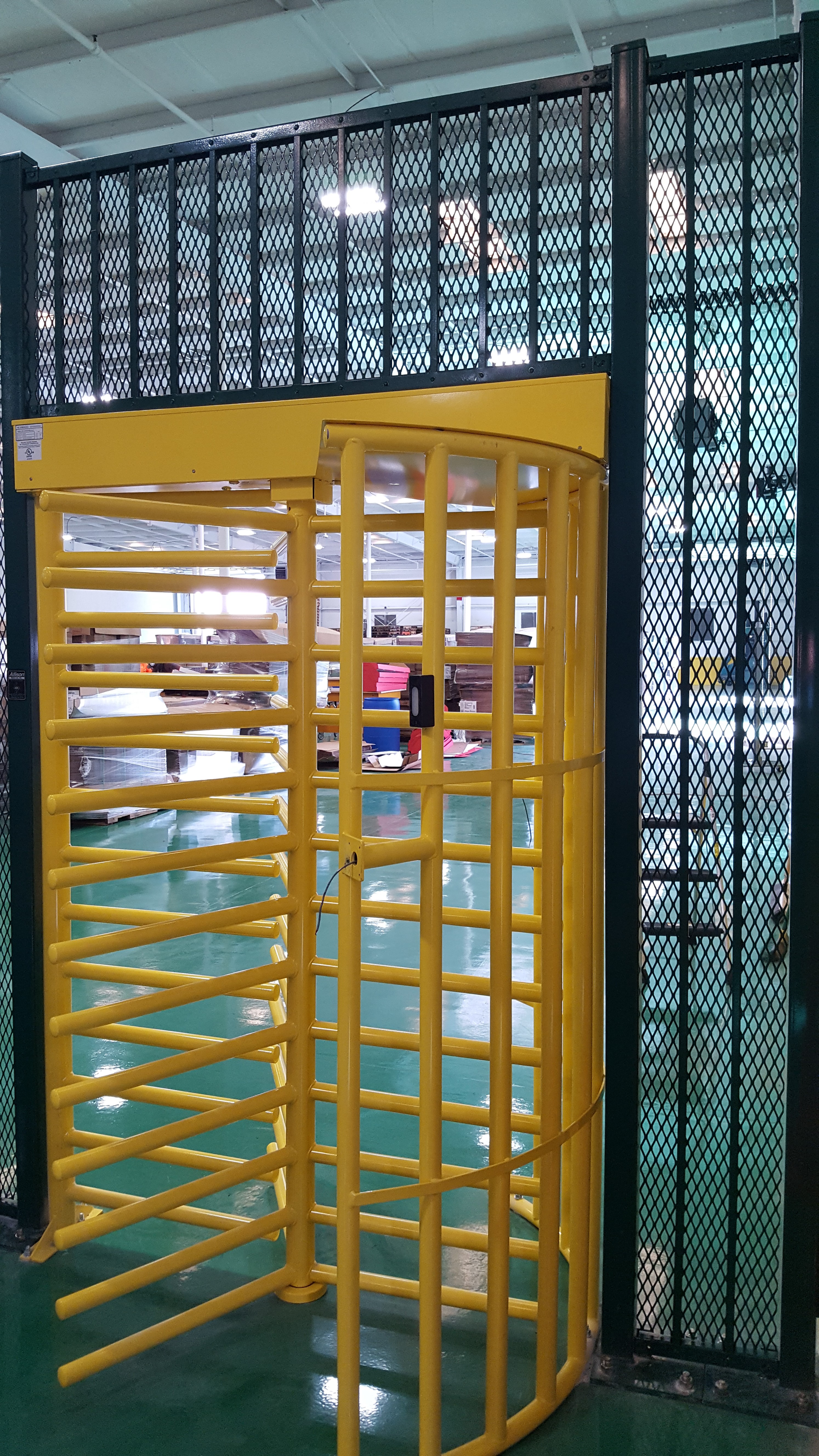 Close up photo of the yellow Alvarado MST full-height turnstile.