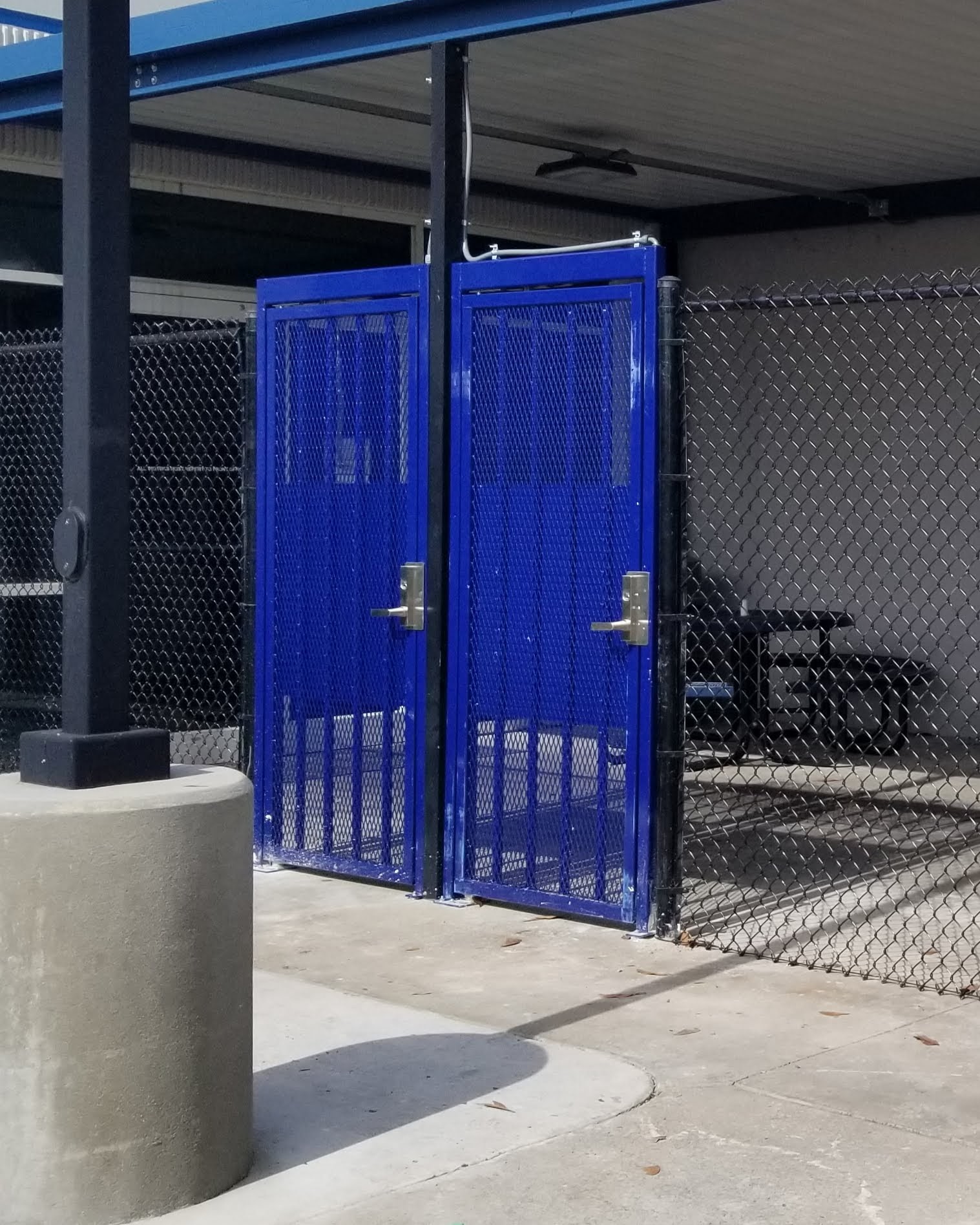 Close up photo of two gates for ADA access and deliveries.